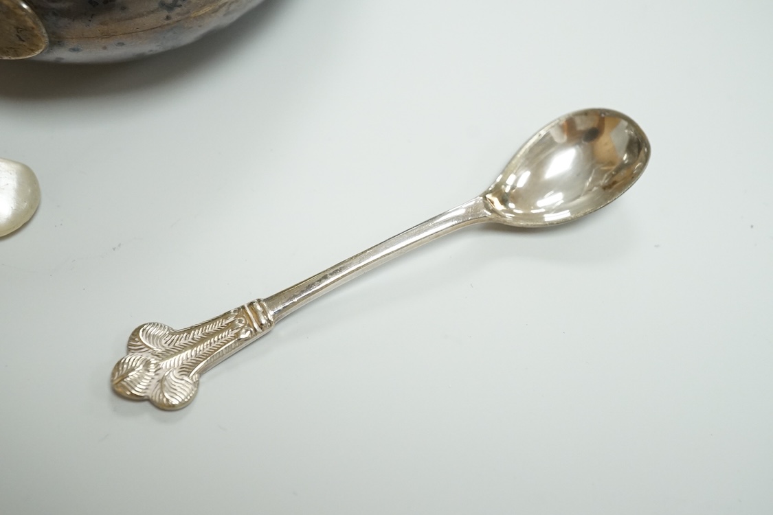 A late 19th century French small white metal Holy Water stoop, 11.4cm, together with a Victorian silver and leather mounted glass hip flask(a.f.), a late Victorian silver 'grenade' lighter by Sampson Mordan & Co, two sil
